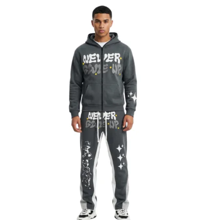 Dark grey full-zip graphic tracksuit with yellow puff print lettering and star details manufactured by Mamoon Wear.