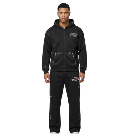 Minimalist all-black full-zip tracksuit featuring white star accent graphics on shoulders, chest, and legs by Mamoon Wear.