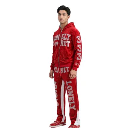Eye-catching vibrant red full-zip tracksuit featuring bold white typography and side piping trim on pants by Mamoon Wear.